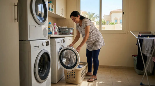 A girl doing laundry her maternity clothes