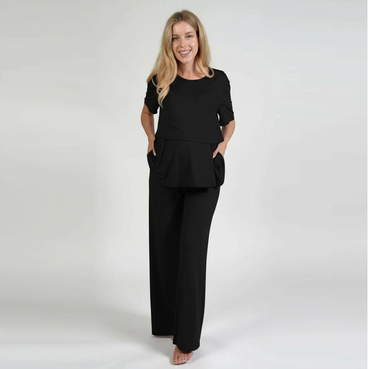 Model wearing the black Everyday Maternity Pants from Bumply Shop

